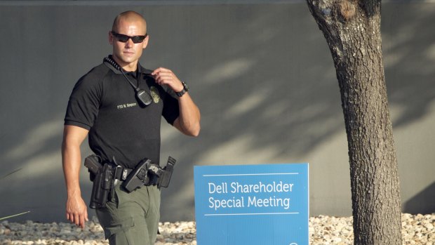 A Round Rock, Texas, police officer guards the Dell shareholders meeting at Dell headquarters in Round Rock, Texas on Thursday, Sep 12, 2013.