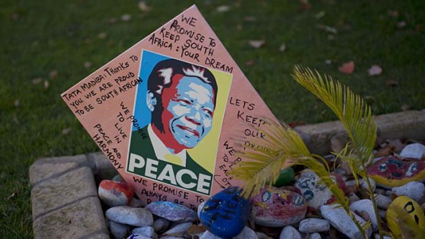 Messages for Nelson Mandela are pictured outside of his Johannesburg home .