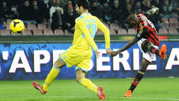Sweet spot: AC Milan's Mario Balotelli scores the winner against Bologna.