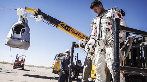 Disappointed ... Felix Baumgartner leaves his capsule after his mission was aborted due to high winds.