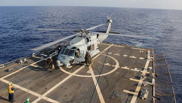 Ocean watch: A US Navy helicopter aboard destroyer USS Pinckney taking part in the search and rescue mission in the Gulf of Thailand.