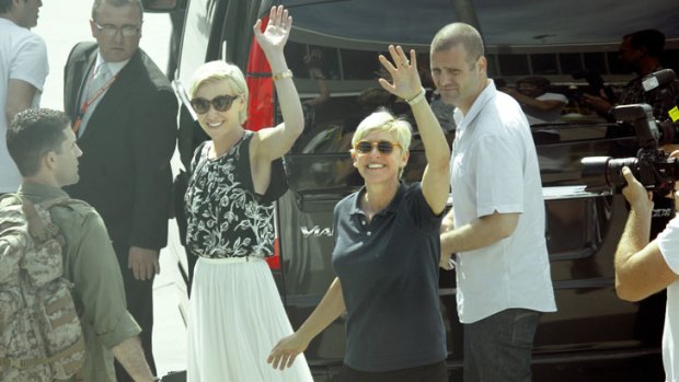 Portia de Rossi, left, and Ellen DeGeneres arrive at Tullamarine Airport
