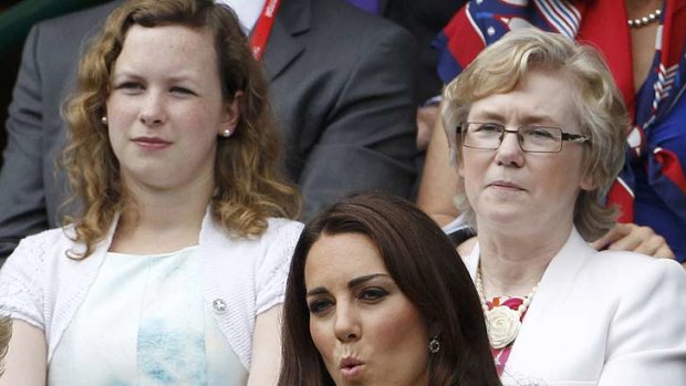 A tense Duchess of Cambridge watches Federer in action.