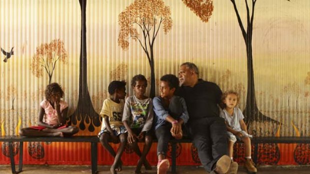 Fought bruising battles ... Aboriginal leader Noel Pearson relaxes  with his son Charlie, 5, and some local children.