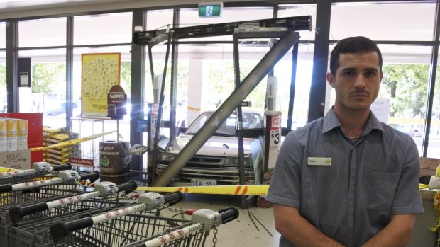 Woolworths worker Peter Fisher said customers had to jump out of the way when a car smashed into the front doors of the Charnwood store on Wednesday.
