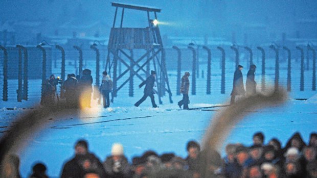 People attend ceremonies to mark the 65th anniversary of the Auschwitz-Birkenau Nazi death camp's liberation.