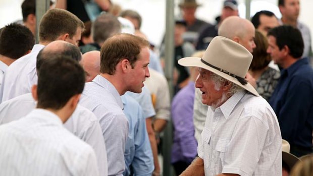 Prince William speaks to a Grantham resident.