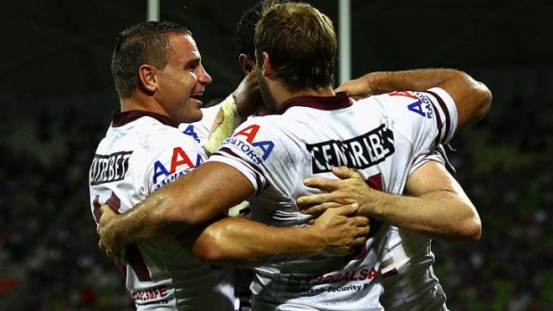 Old firm ... Anthony Watmough, left, embraces Brett Stewart in the loss to the Storm at the weekend.