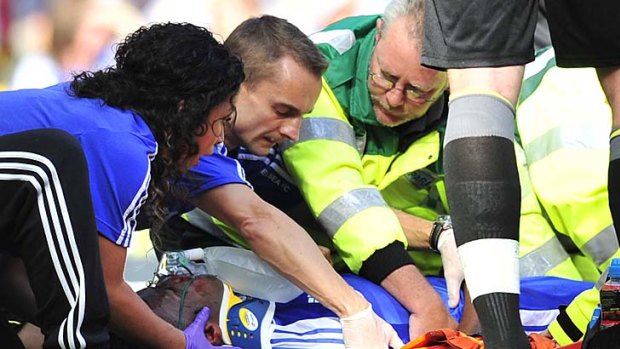 Paramedics attend to Didier Drogba after his collision with Norwich's English goalkeeper John Ruddy.