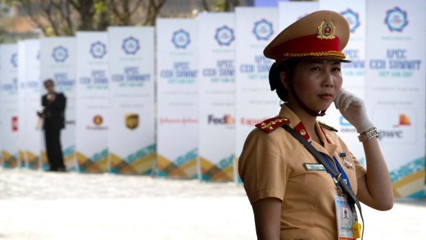 A security official stands on guard outside the venue for the Asia-Pacific Economic Cooperation CEO Summit in Da Nang, Vietnam.
