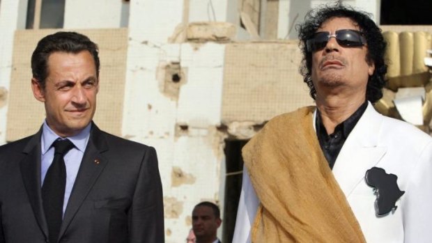 A file picture of the then president Nicolas Sarkozy with former Libyan leader Muammar Gaddafi. Mr Sarkozy is under investigation for receiving campaign funds from the Libyan dictator.