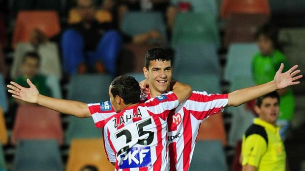 Eli Babalj celebrates with Adrian Zahra after scoring a goal.