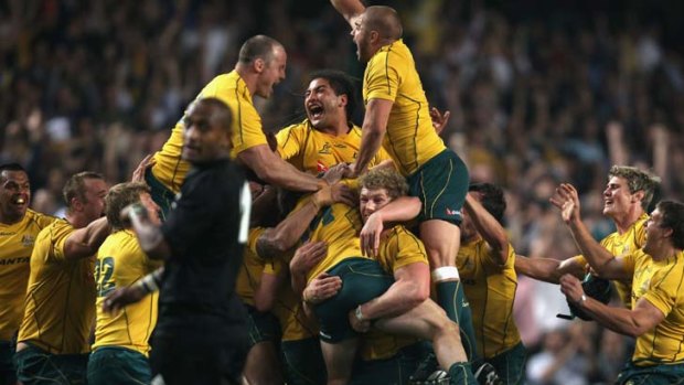 The losing run ends ... after Quade cooper's shove of the opposition captain, the Wallabies celebrate their Bledisloe Cup win over New Zealand.