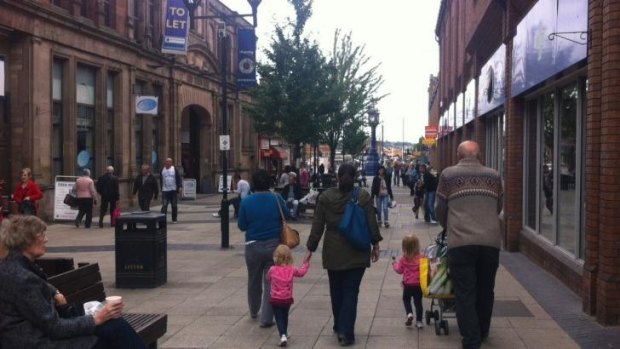 Shoppers walk through the streets of Rotherham on Wednesday, the day after a report claimed at least 1400 children have been abused in the town.