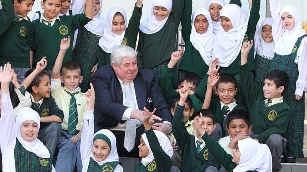 Guiding principal: Dr Ray Barrett with some of the pupils at Malek Fahd in Greenacre.