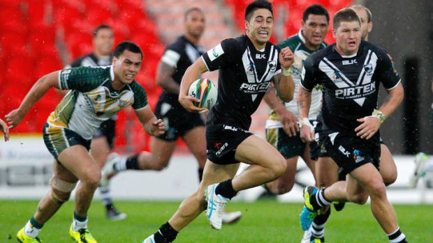 Shaun Johnson makes a break against the Cook Islands in a warm-up game.