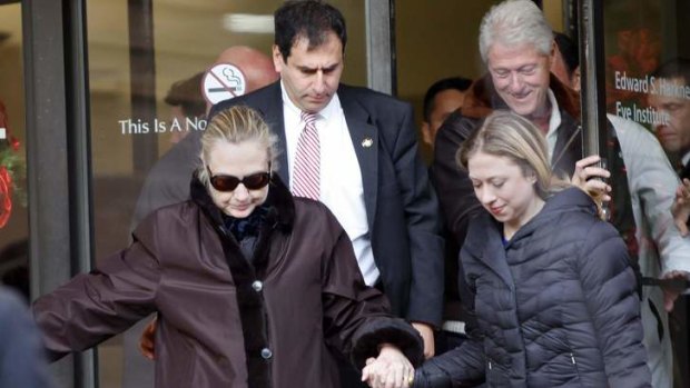 Hillary Clinton leaves New York's Presbyterian Hospital with daughter Chelsea and husband Bill on Thursday.