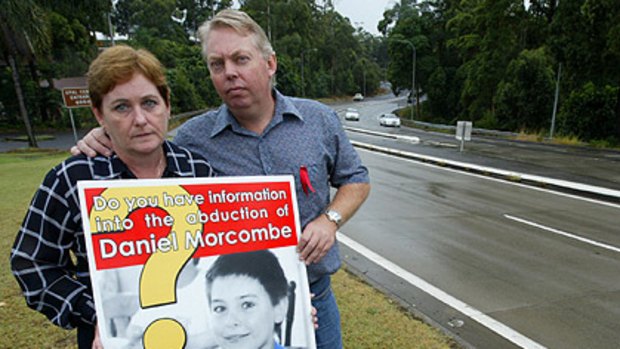Bruce and Denise Morcombe with a poster about their son Daniel's disappearance.