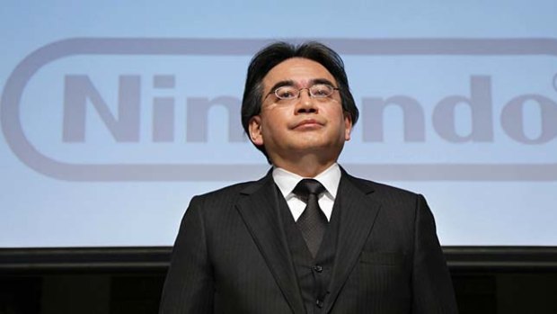 Nintendo president Satoru Iwata speaks at a press conference in Tokyo on Friday.