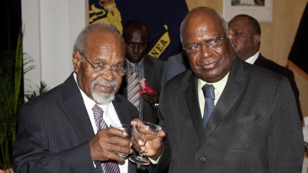 Sir Michael Somare (left) and Governor-General Michael Ogio at the swearing-in of Sir Michael's PNG cabinet. The country is in the grip of a constitutional nightmare as two men lay claim to governing the country.