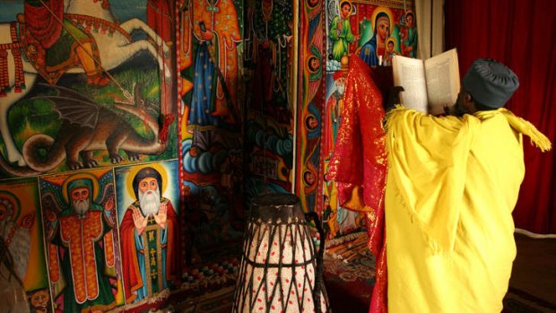 A priest reads from the Bible in Entos Eyesu Monastery in Lake Tana.