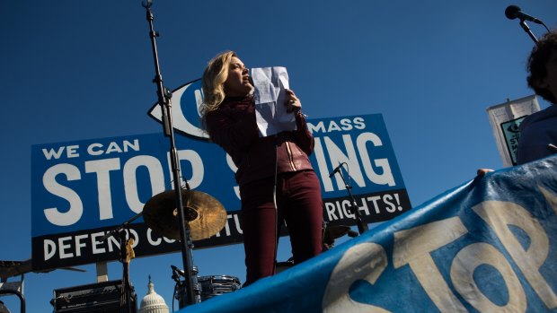 A woman speaks at the Stop Watching Us rally in Washington, DC.