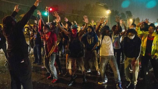 Protesters defied the midnight curfew in Ferguson.