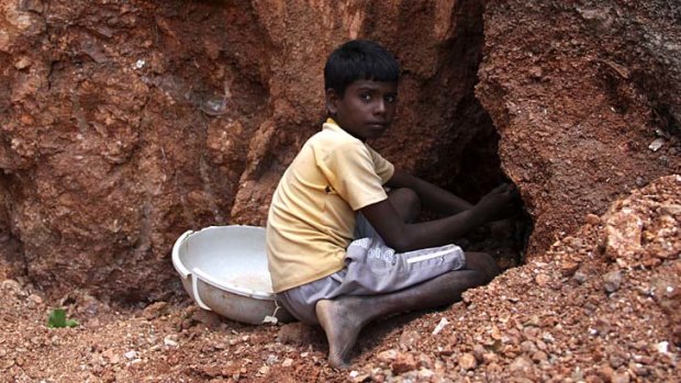 Hard labour: Mohammed Salim Ansari, 12, works in an illegal mica mine.