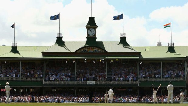 Sachin Tendulkar celebrates reaching his century in front of the SCG's iconic Members' Pavilion.