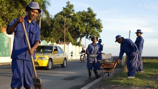 Keeping up appearances ... a group of street sweepers clean up for the independence celebrations in the capital, Dili. The roads from the airport have been resealed and squatters moved on before the arrival of visiting dignitaries.