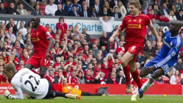 Gerrard is unable to stop Demba Ba's goal after the Liverpool midfielder slipped and gifted possession to the Chelsea striker.
