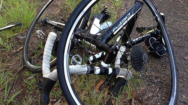 The remnants of Brendan Braid's bicycle after he was struck by a vehicle and flung from his bike on the Old Princes Highway at Helensburgh on Sunday.