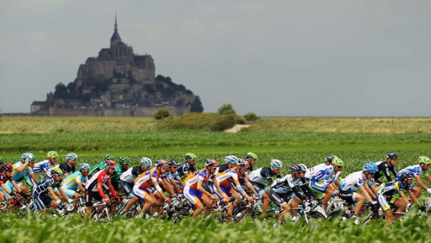 Time trial venue ... the peloton passes by Mont Saint-Michel in the 2011 Tour de France.