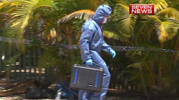 A forensics officer at the victim's Macleay Island home.