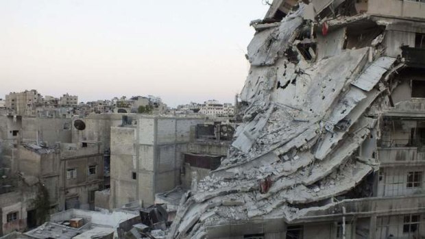 Rebel stronghold: Buildings damaged by what activists said was shelling by forces loyal to Syria's President Bashar al-Assad in Homs.
