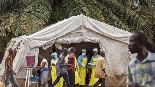Health workers screen people for Ebola at Kenema Government Hospital, Sierra Leone.