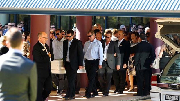A life remembered: mourners carry the coffin of Kate Malonyay.