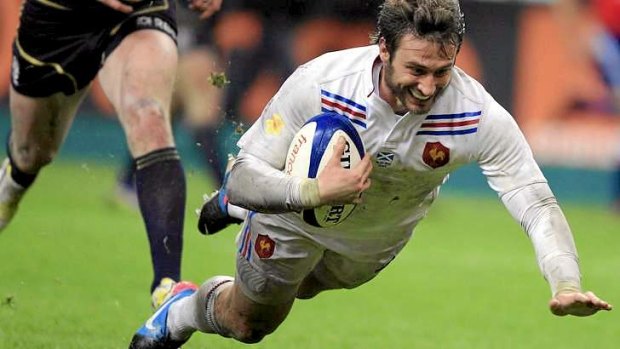 Maxime Medard scores the match-sealing try for France.