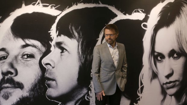 Bjorn Ulvaeus, above, poses in front of a portrait of Abba in the museum dedicated to the band in Stockholm.