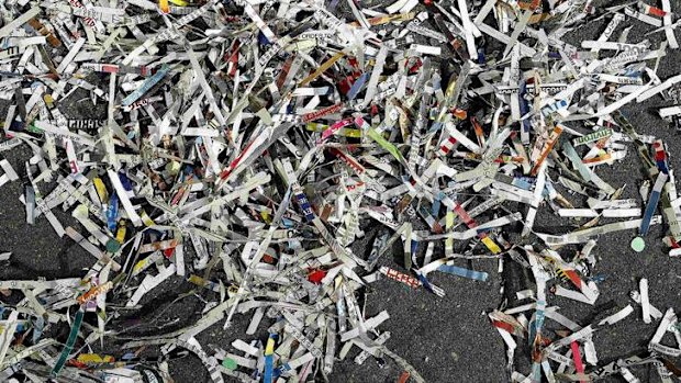 Garbage and confetti lie on the ground after the Macy's Thanksgiving Day Parade in New York.