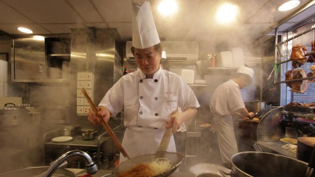 Haute Hong Kong ... Lai Wai Hung prepares noodles in his one-star restaurant, Hung's Delicacies.