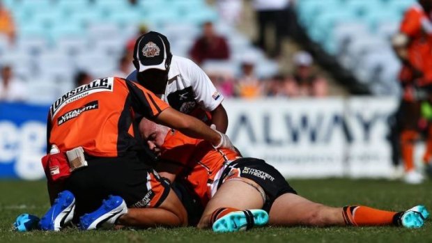 Concussed: Liam Fulton of Wests Tigers had to be stretchered off against St George Illawarra.