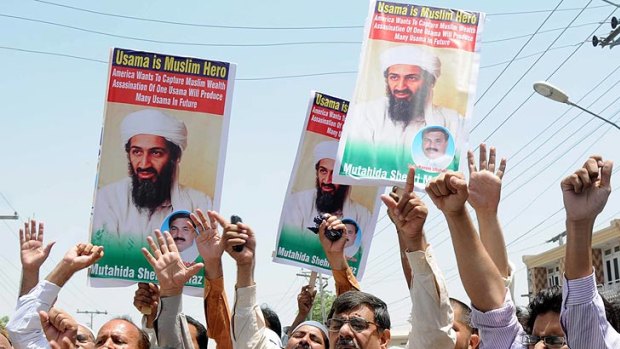 'Unauthorized unilateral action' . . . people rally to condemn the killing of al-Qaida leader Osama bin Laden.
