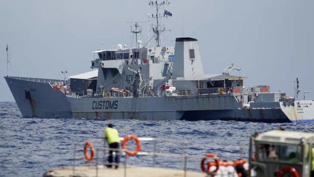 Reports have emerged in recent days of Australian vessels Triton (pictured) and Bathhurst sailing off Christmas Island, with an orange boat in tow.