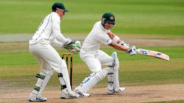 Australia captain Michael Clarke adds some timely runs as he's watched by Worcestershire wicketkeeper Ben Cox during the tour match at New Road.