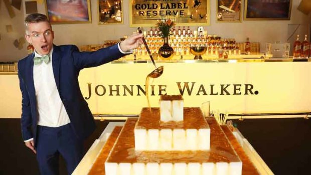 "Architectural food artist" Sam Bompas with the whisky fountain he has created for the Johnnie Walker marquee.