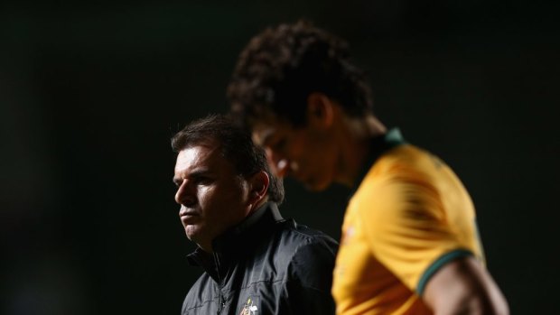 The Socceroos coach is aloof with his players.