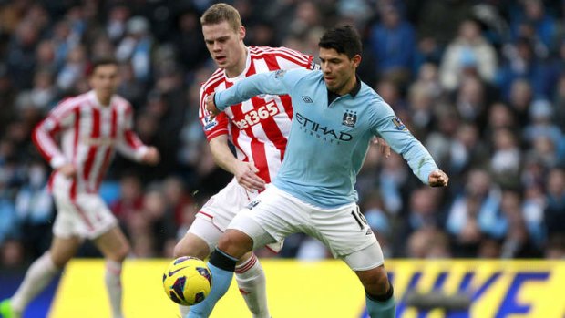 Stoke City's Ryan Shawcross and Manchester City's Sergio Aguero battle for the ball.