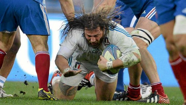 Big unit ... Italy's prop Martin Castrogiovanni goes to ground.
