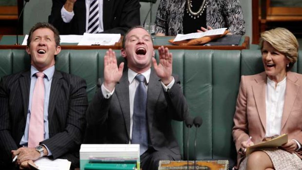 Julie Bishop and Luke Hartsuyker join Christopher Pyne (centre) in a laugh at remarks made by Acting Prime Minister Wayne Swan during question time yesterday.
